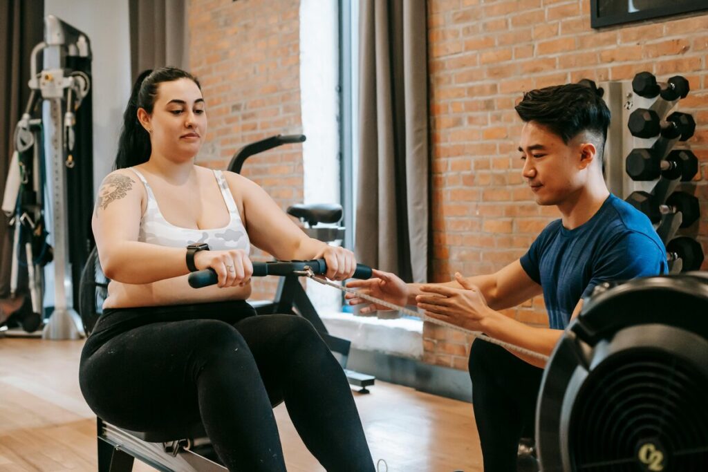 women using rowing machine 