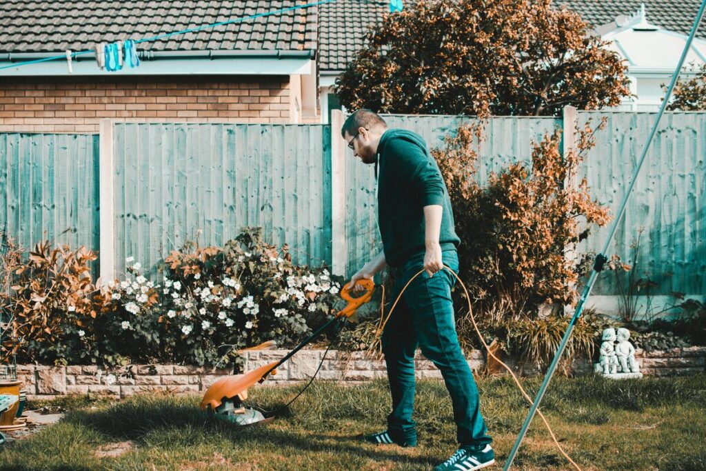 man using a lawn mower 